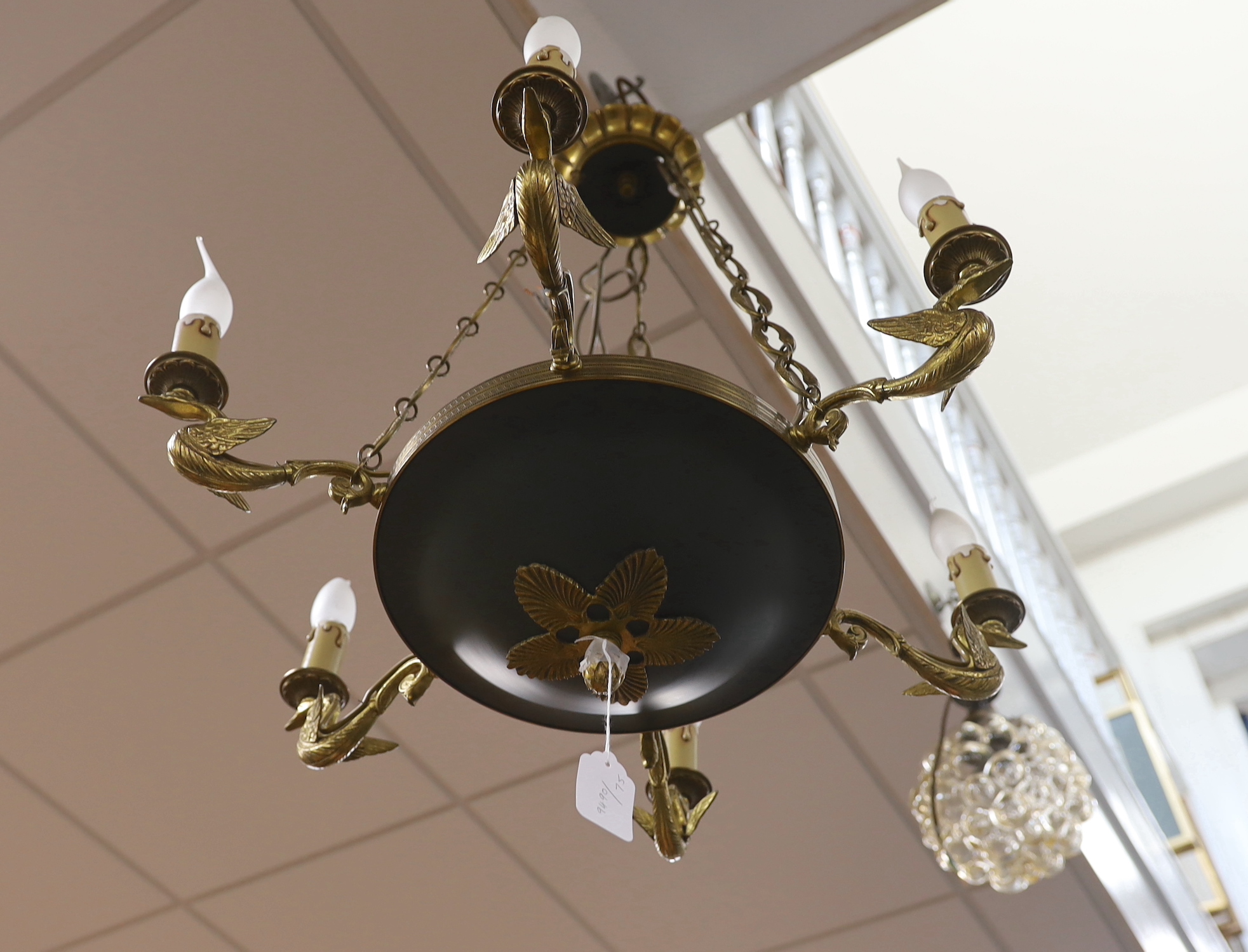 A French Empire style gilded bronze and tole ware six branch light, approximately 68cms high